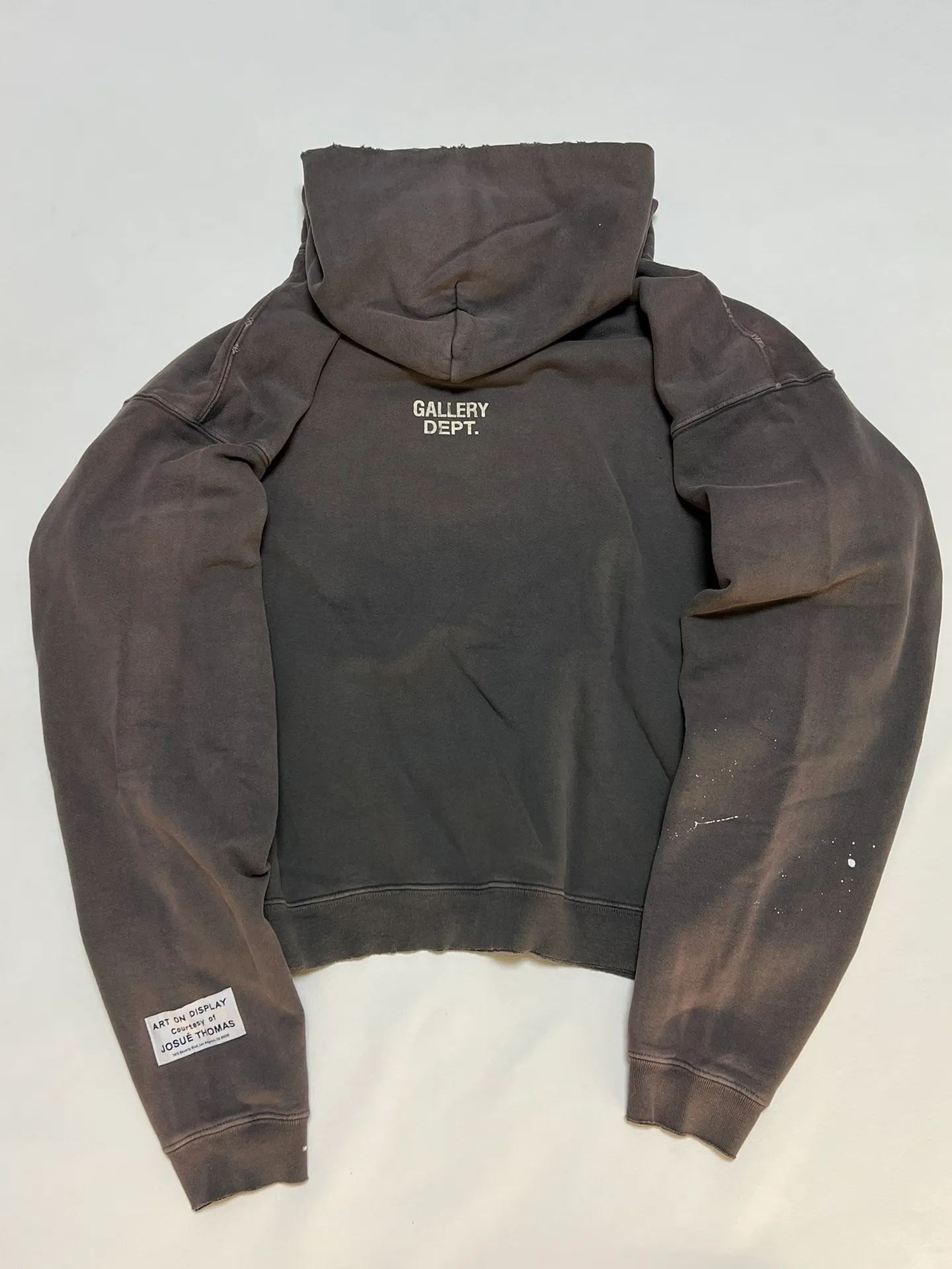 GALLERY DEPT. 90'S RECYCLE HOODIE WASHED BLACK 90'S washed hoodie with distressed eco-friendly slogans. Washed black S-XL. Ready-made garments are washed and dyed again. Multiple spots throughout the body are spray-faded. The ribs are cut and worn.
